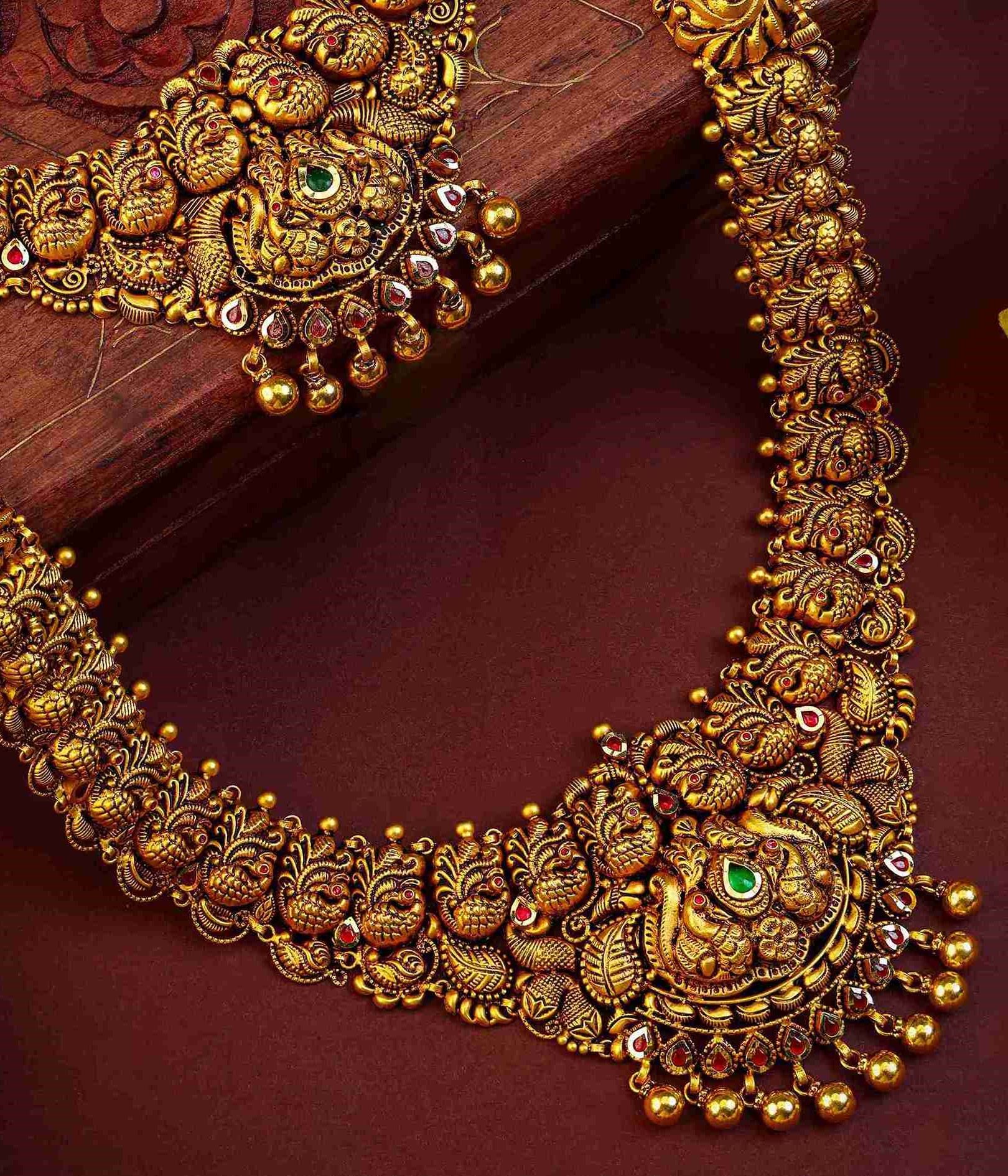 Gold necklace and jhumka earrings set by Sri Nageshrao Jewellers